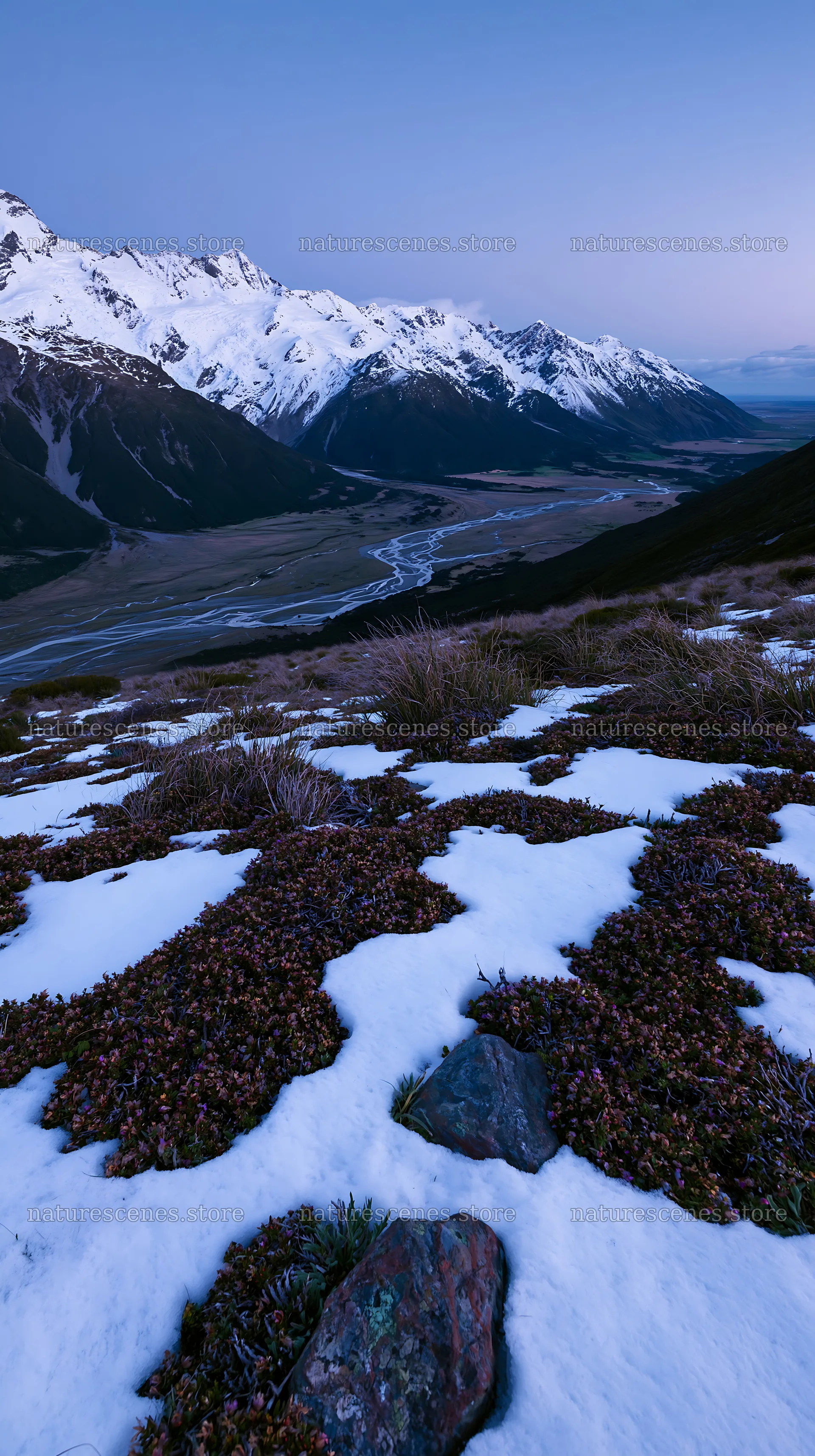 Snowmelt meadow with mountains and river at dusk – nature scenes 5938x10608