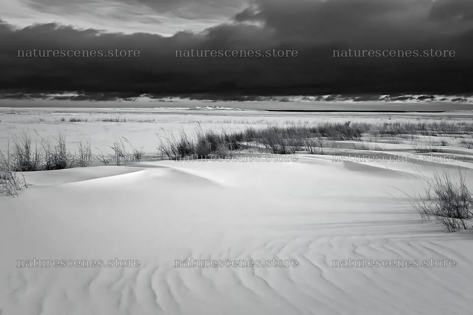 Snowdrift meadow under a dark cloudy sky – nature scenes 9722x6480