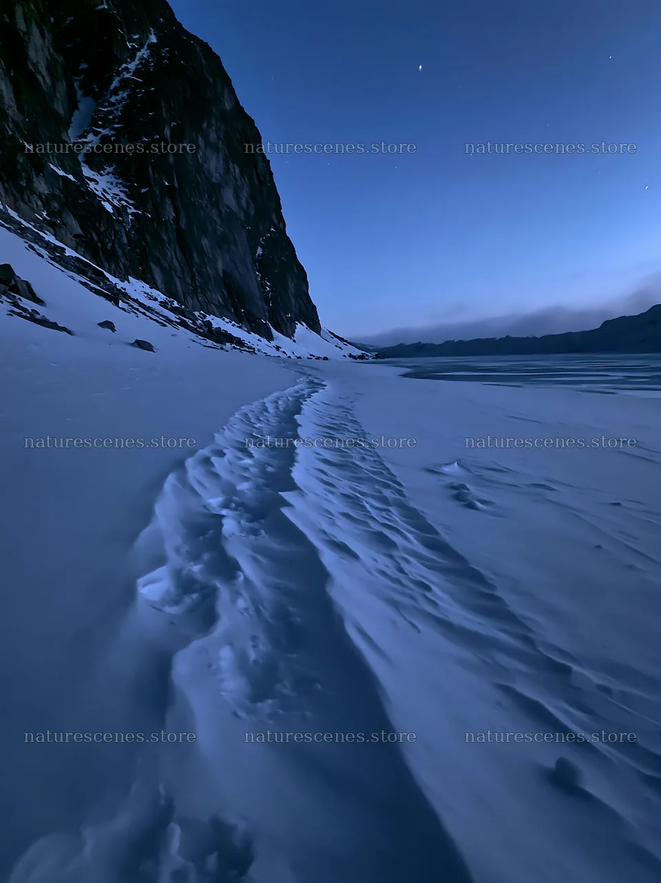 Snowy lakeside meadow at dusk with snow-covered trail – nature scenes 6866x9174