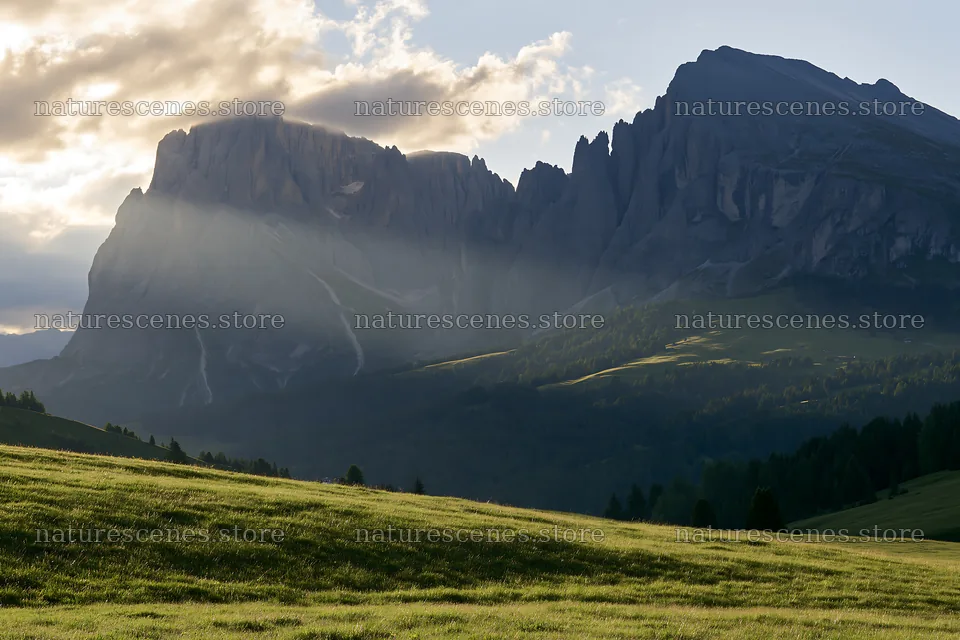 Sunbeams over Alpe di Siusi meadow and mountain peaks – nature scenes 9722x6480